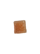 A single square, sugar-coated gummy piece on a solid white background.