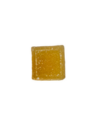 A single square, sugar-dusted gummy candy in a translucent amber-yellow color, isolated on a solid white background.
