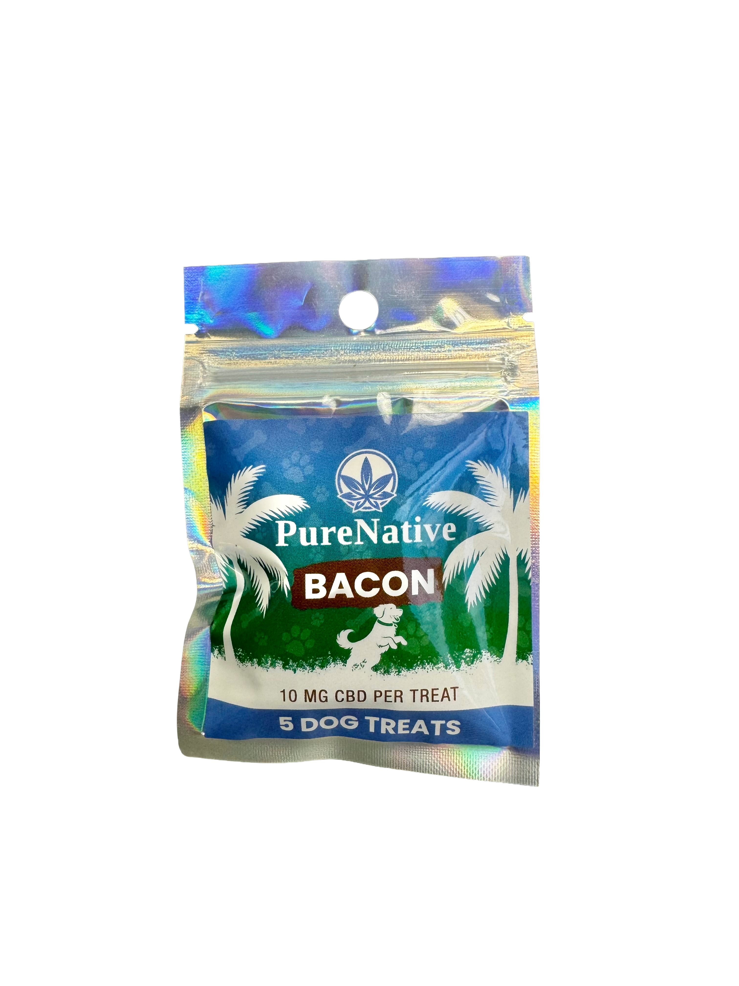 A package of PureNative Bacon dog treats in a holographic zip-top pouch with a blue front label featuring palm trees and a dog silhouette.