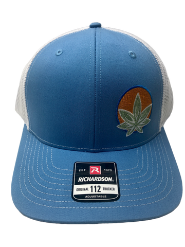 PureNative logo embroidered on columbia blue background of a Richardson trucker hat.